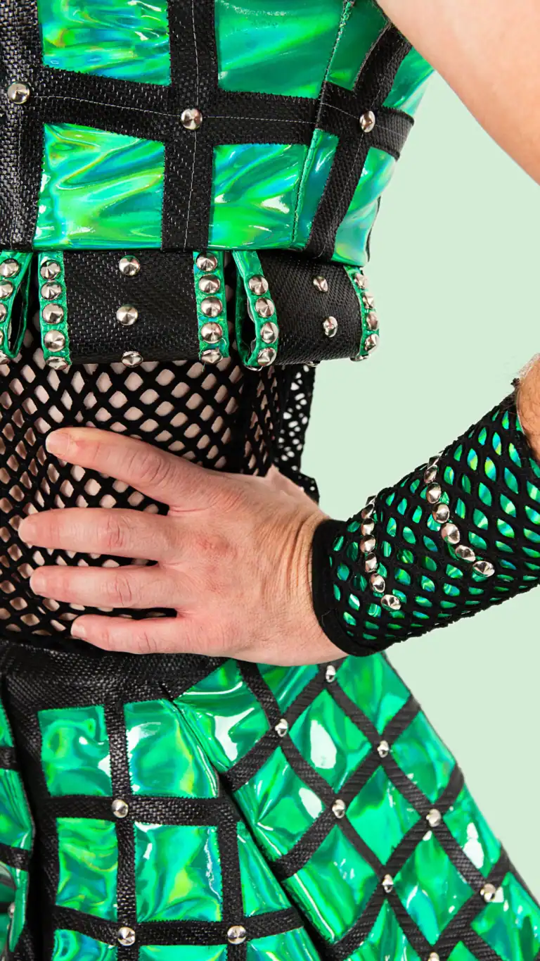 Designs Elijah's custom Anne Bolin costume from SIX the musical, close up of layered details.
