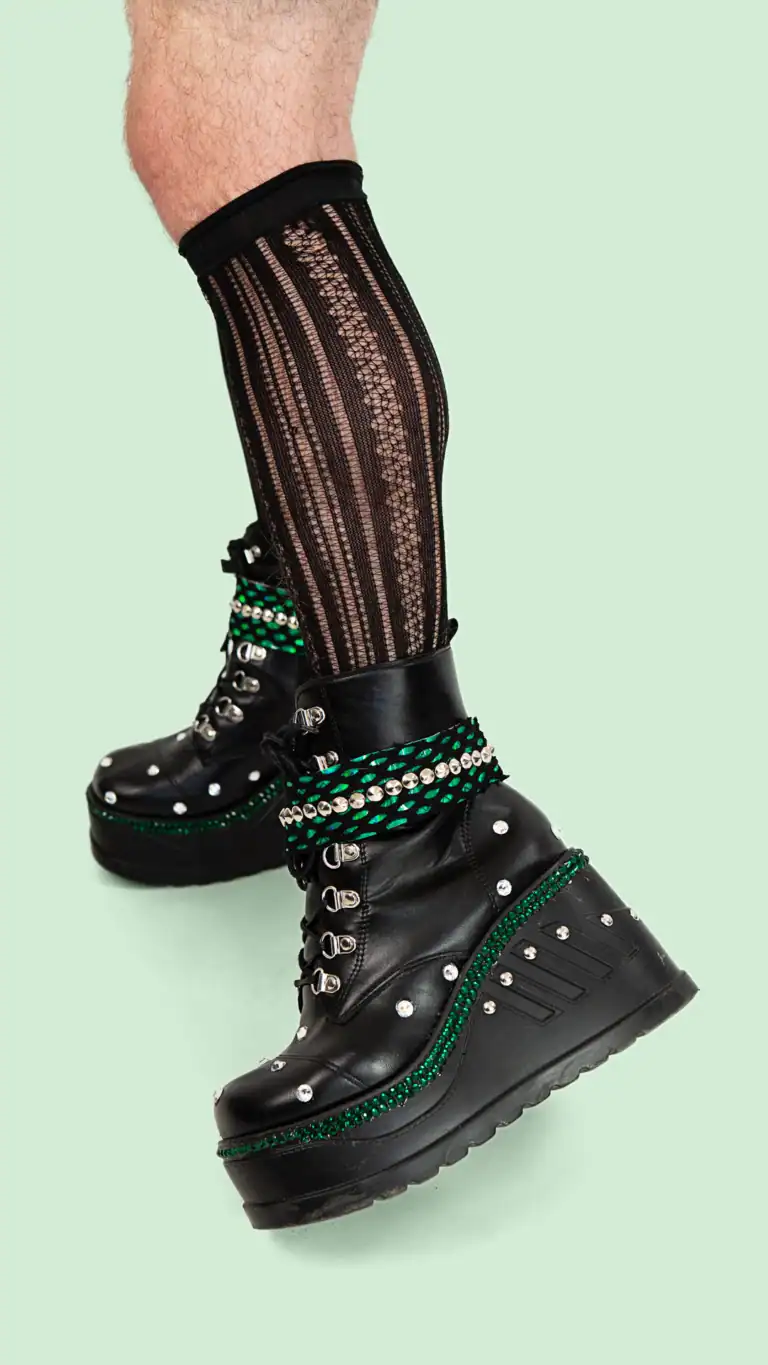 Designs Elijah's custom Anne Bolin costume from SIX the musical, close up of platform boots with punk detail.