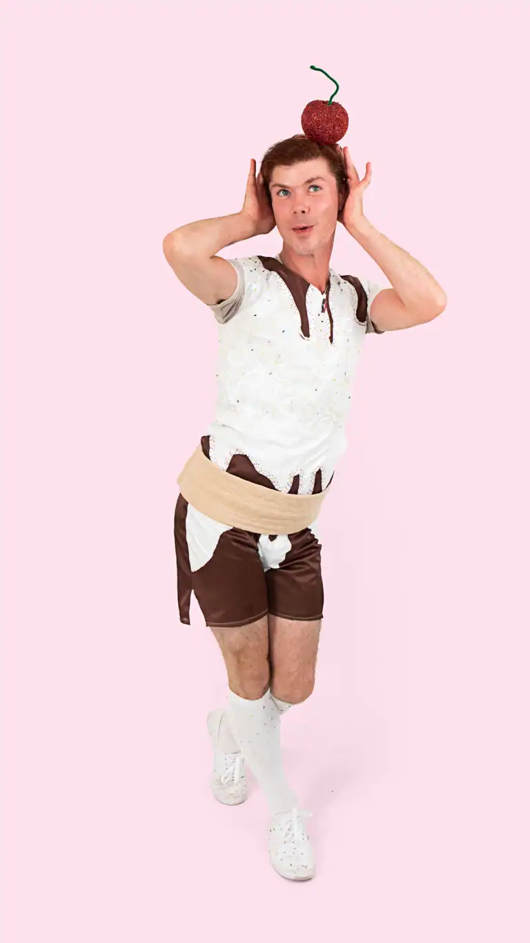 Designs Elijah in cute pose in a Sundae costume, with a cherry on top.