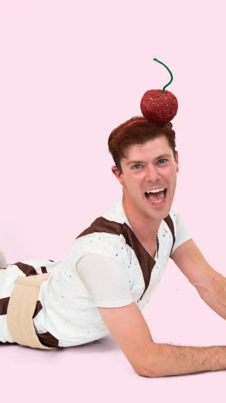 Designs Elijah's Sundae costume, with a cherry on top as a headband.