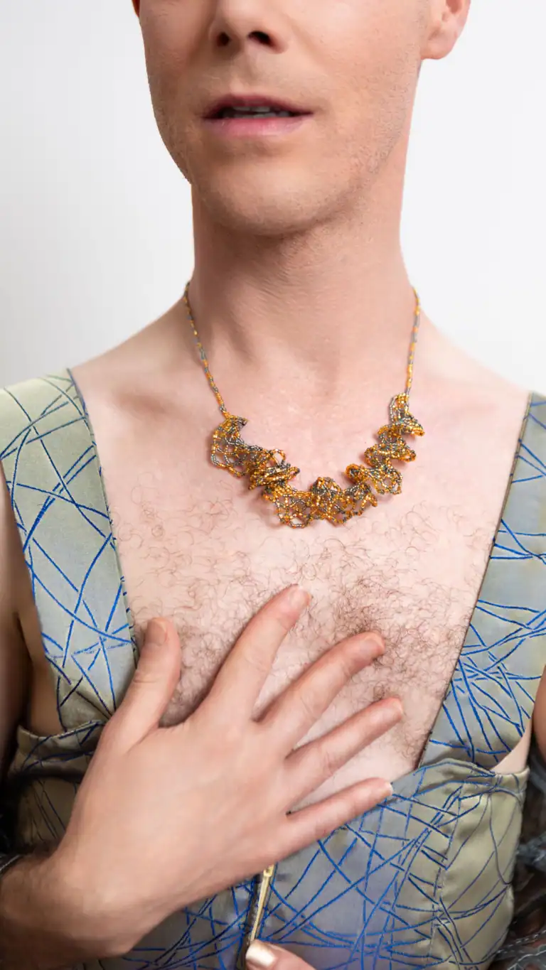 Designs Sexy romper design with detailed luxury fabric showing chest hair and gold detailed necklace.