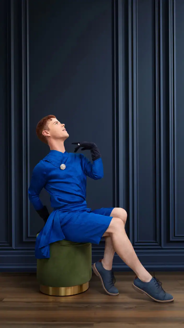 Designs Gender-fluid fashion designs for men, blue shorts and top in a flowy fabric with feminine details.