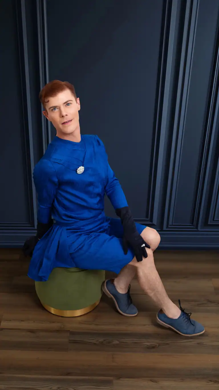 Designs Gender-fluid fashion designs for men, blue shorts and top in a flowy fabric with feminine details.