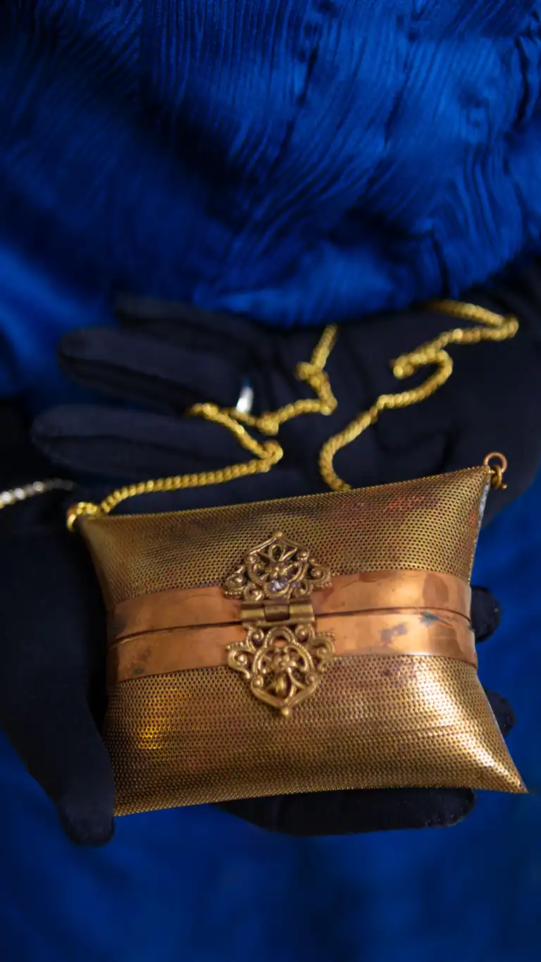 Designs Gender-fluid fashion designs for men, close up of vintage purse.